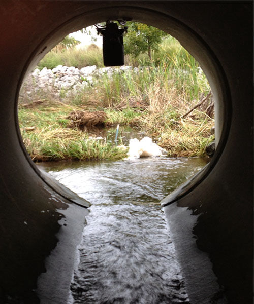 Storm water monitoring with a non-contact flow meter